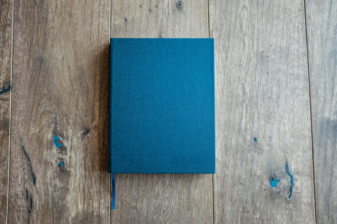 Blue hardcover book on a table
